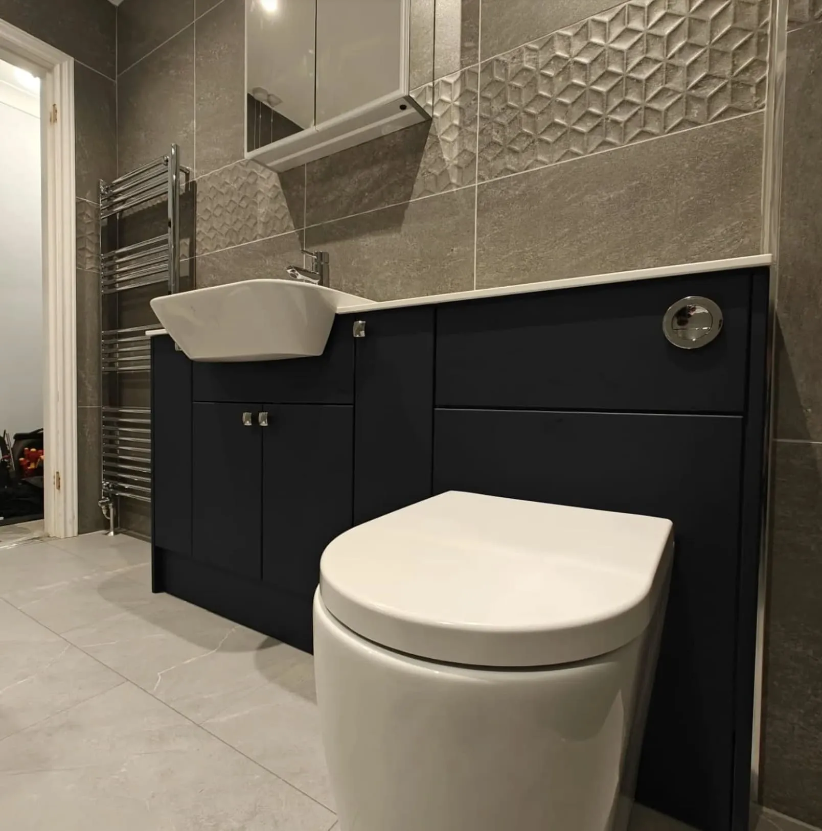 Fitted bathroom furniture and modern toilet