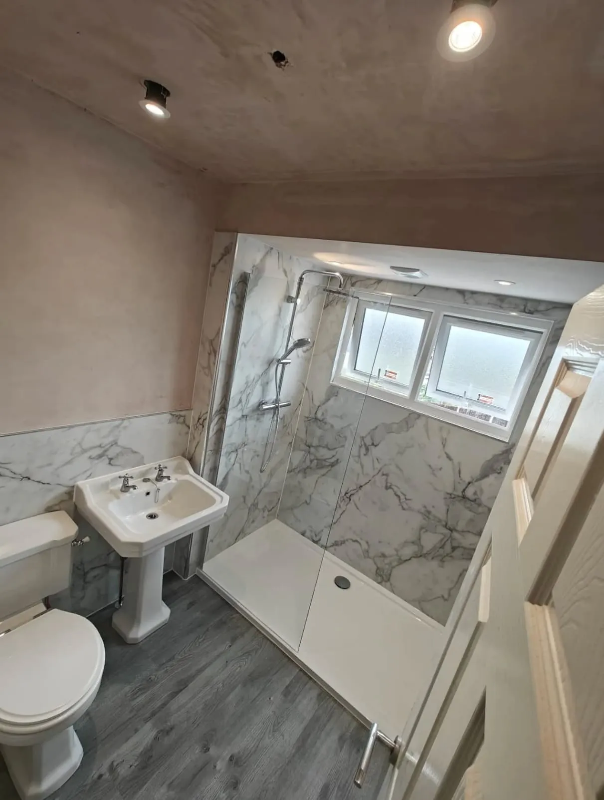 Bright bathroom renovation with walk-in shower